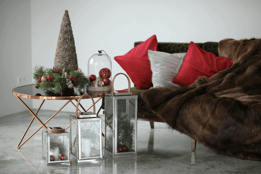 Mental health tip from Tampa Counseling Place in Tampa, Florida: Create a cozy self-care space with soft textures, like this welcoming living room featuring a plush fur blanket draped over a comfortable couch alongside a thoughtfully decorated side table