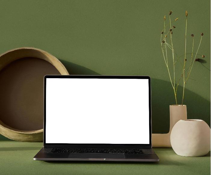 Online vs. In-Person Therapy | Which Is Right for You? Tampa Counseling Place blank computer screen against a green background with neutral accent decorations